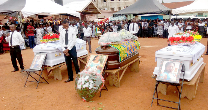The caskets containing the remains of the Santasi fire victims Santasi fire victims buried